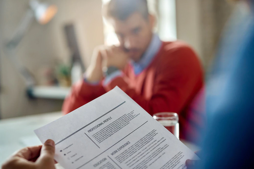 closeup member human resource teal reading candidate s cv during meeting office 637285 6913