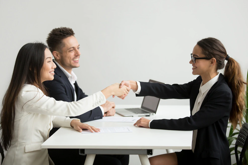 smiling diverse businesswomen shake hands group meeting deal concept 1163 4686